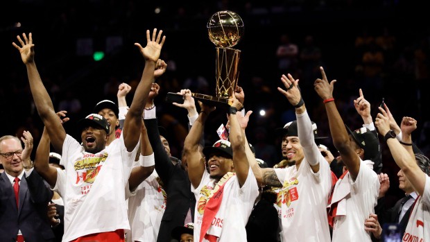 The Toronto Raptors, basketball team, holding a trophy after winning the championship in 2019