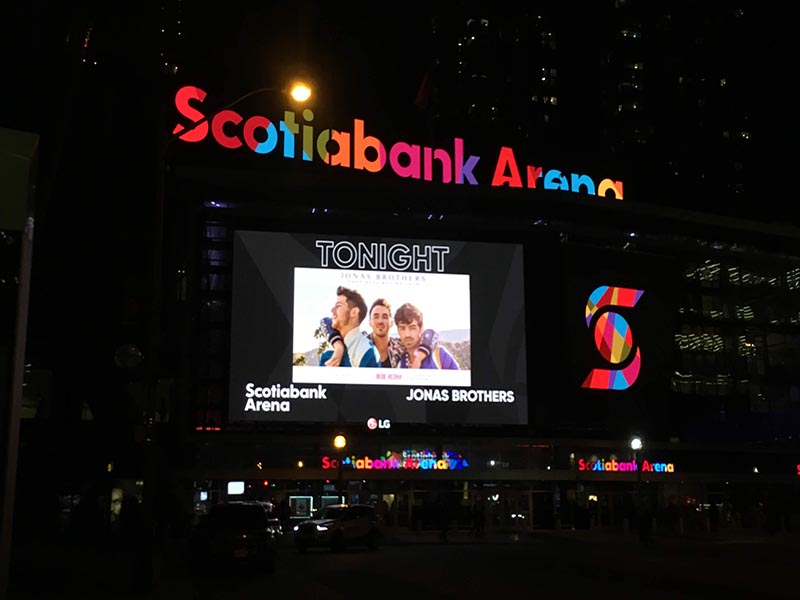 A digital billboard promoting a Jonas Brothers concert at Scotiabank Arena, where the concert was happening that night.