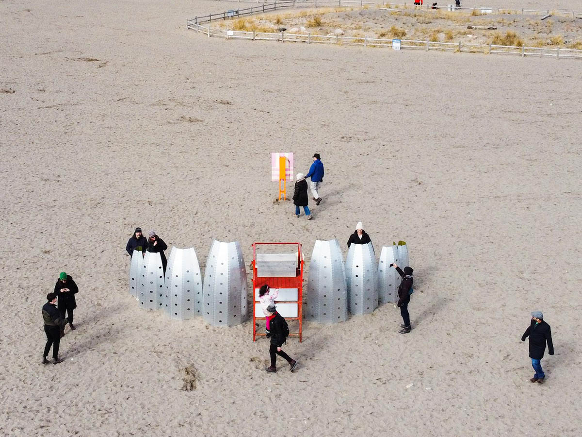 TMU's Winter Stations exhibit of stylized metal canoes on the beach.