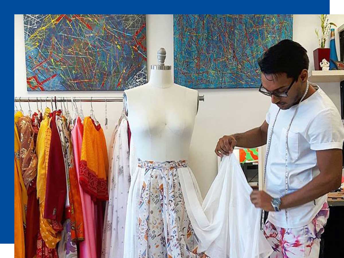 Narishdath Maraj works on a skirt in his studio.