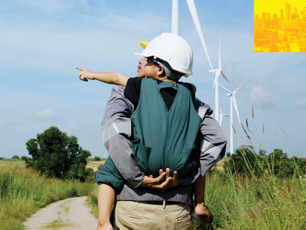 The Forefront — An adult and child walking through a field of wind turbines