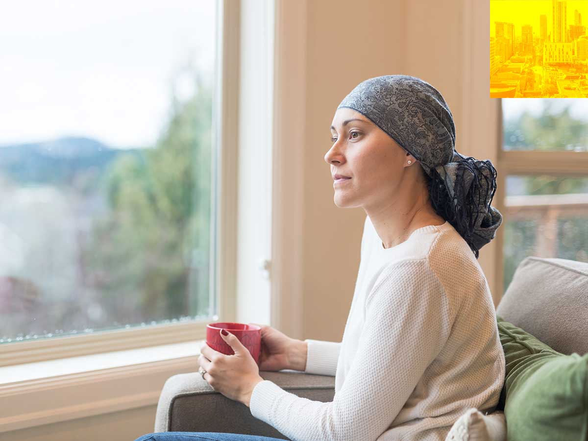 Person sitting on a couch looking out the window