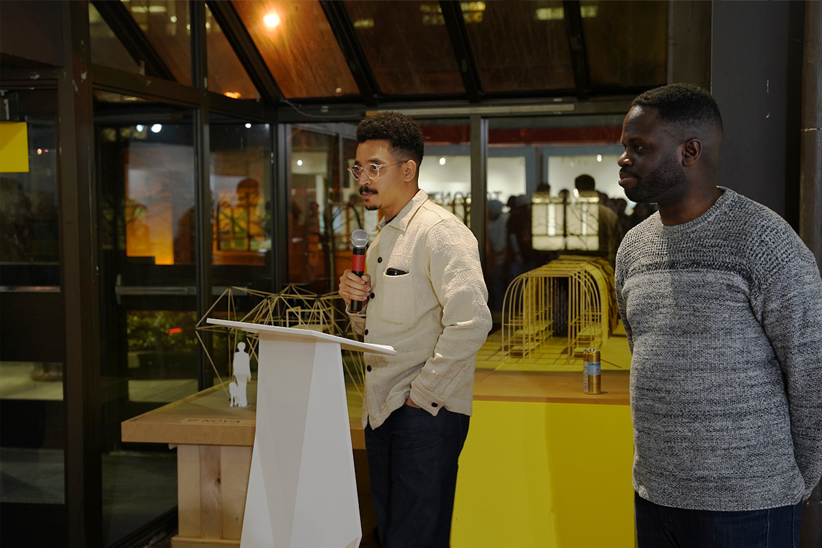 Tura making a speech on the opening night of the SOCA exhibition