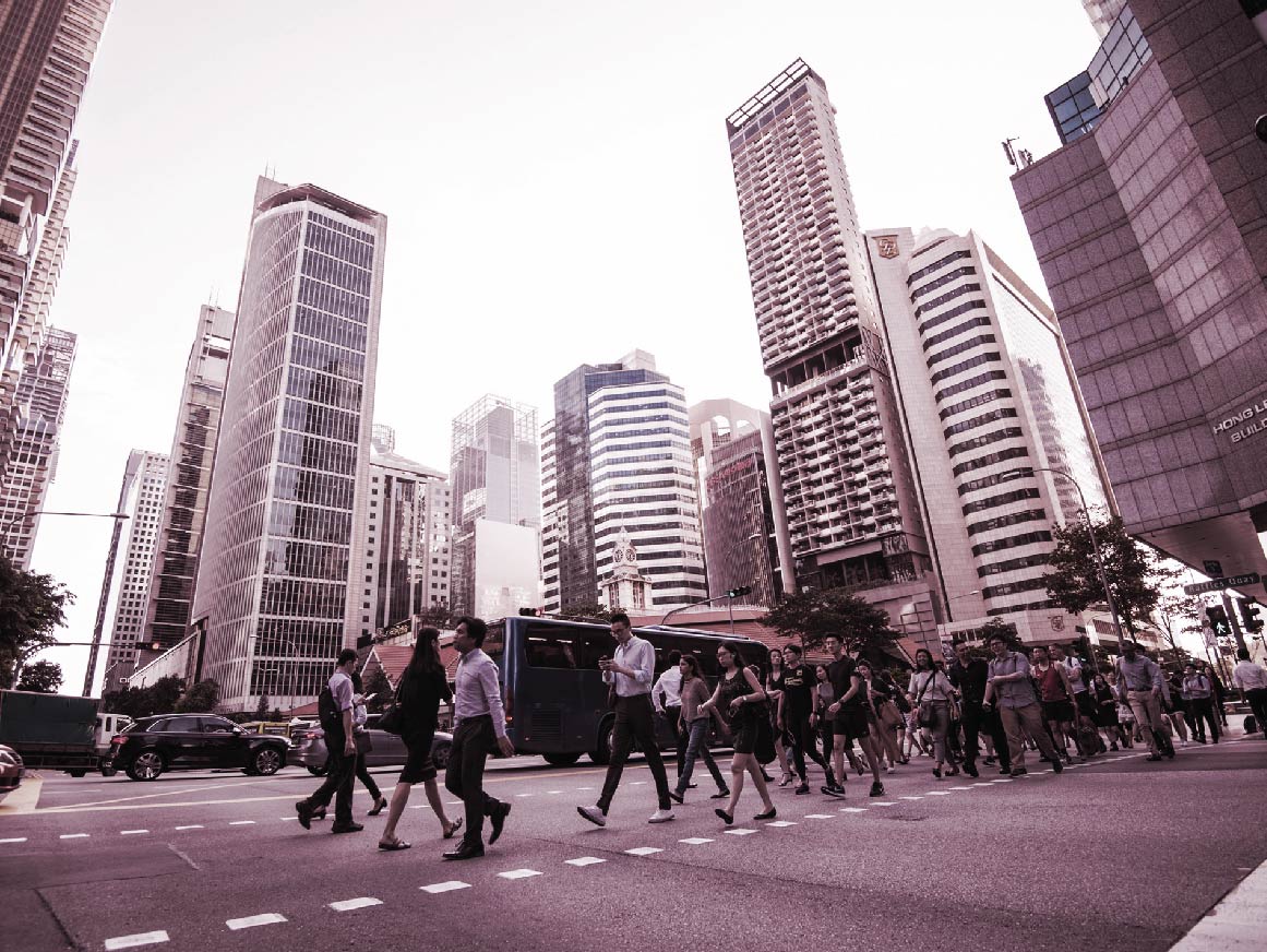 At the end of the working day office workers walking on the streets of the Central Business District of Singapore