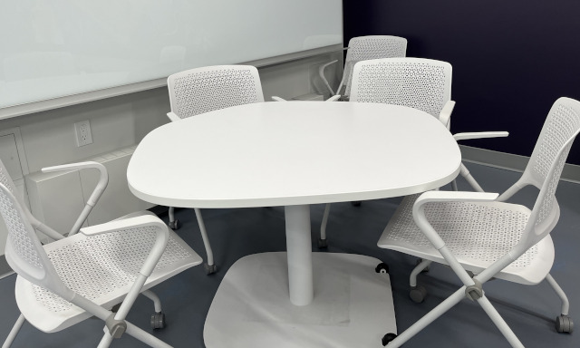 Collaborative Table in a hexagon shape with chairs surrounding