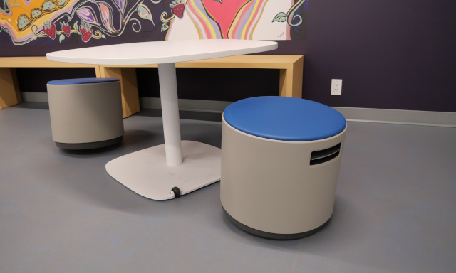 Two balance stools set up for seating at a pentagonal collaboration table