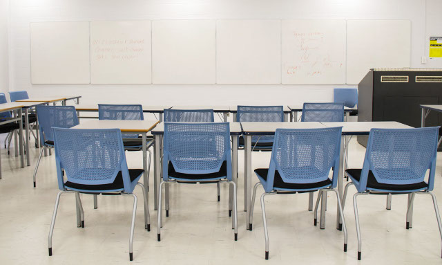 Chairs and desk in a Toronto Metropolitan University classroom