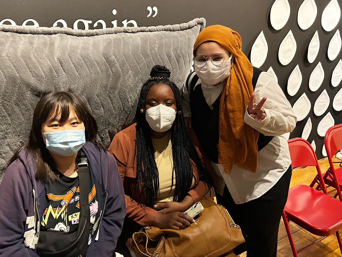 Three female participants in masks.