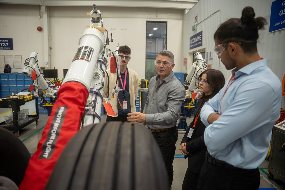 Teacher and student gathered around equipment