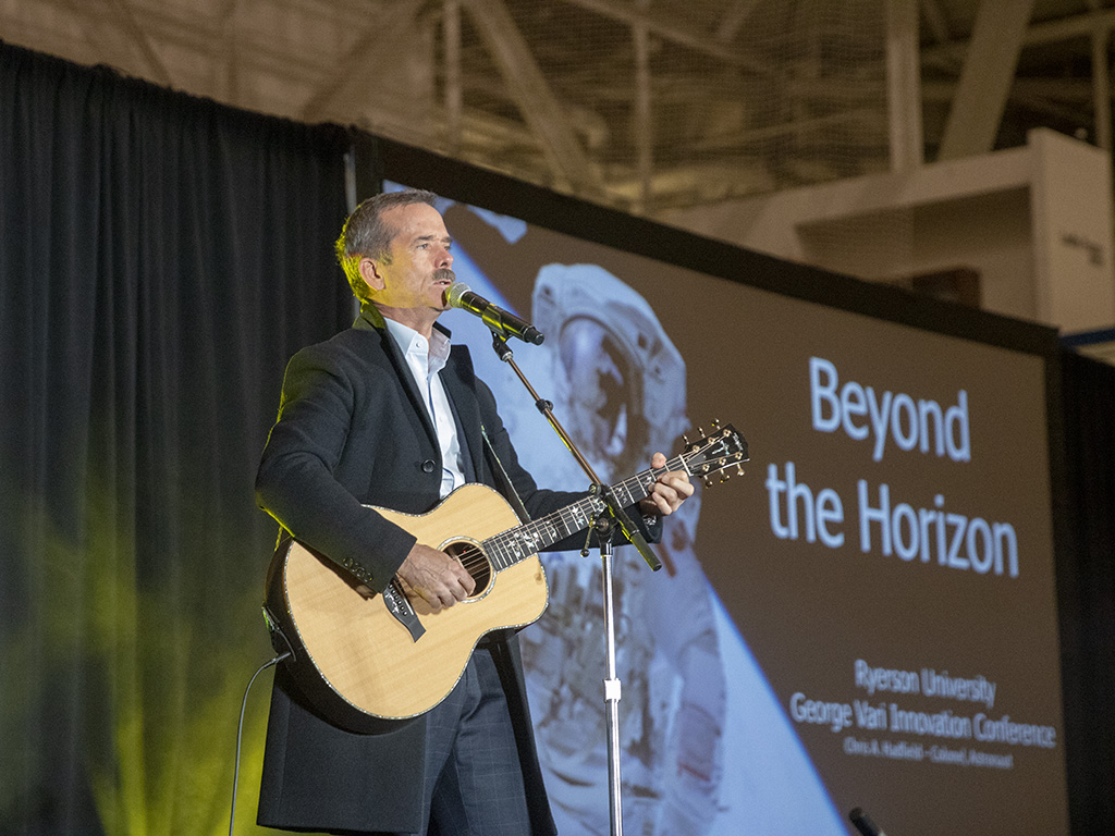 Chris Hadfield playing guitar