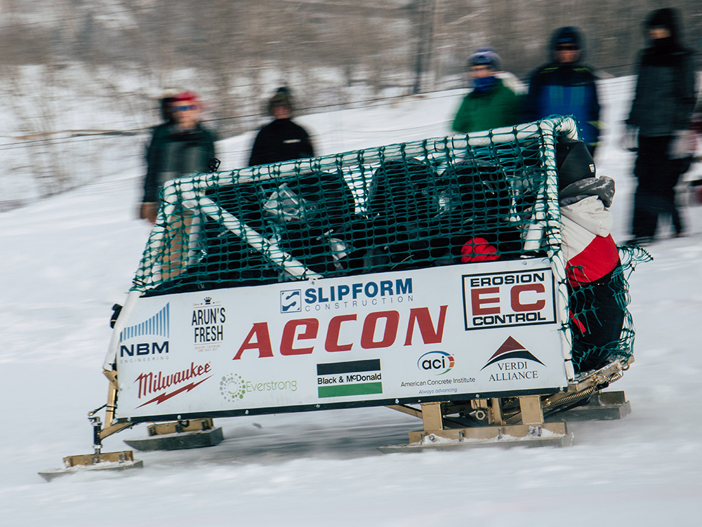 Toronto Metropolitan University Engineering Concrete Toboggan Team on a toboggan