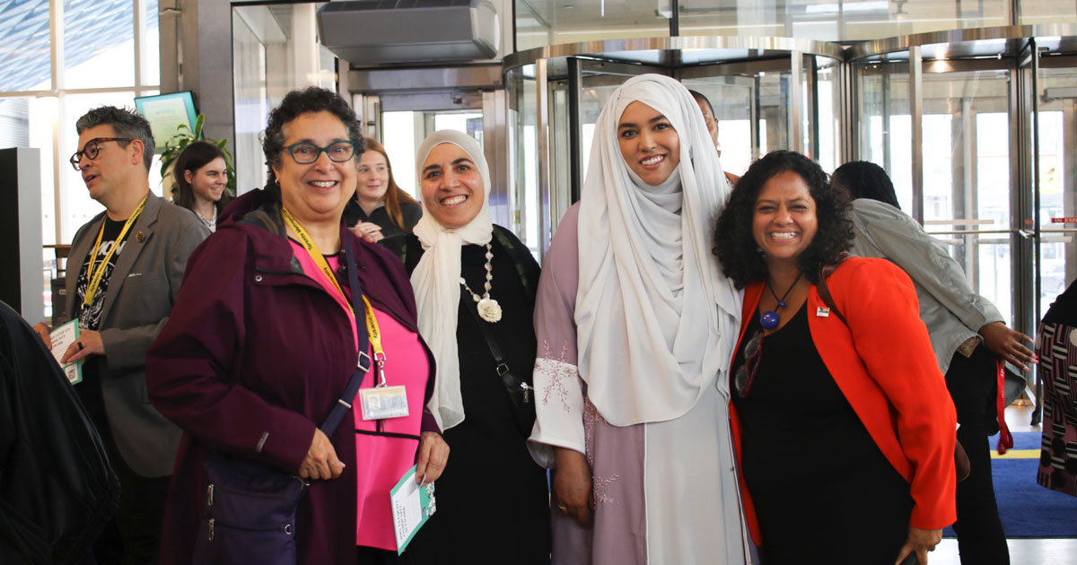 TMU staff members, including two Muslim women and Vice-President, Equity and Community Inclusion, Tanya De Mello, at a TMU event