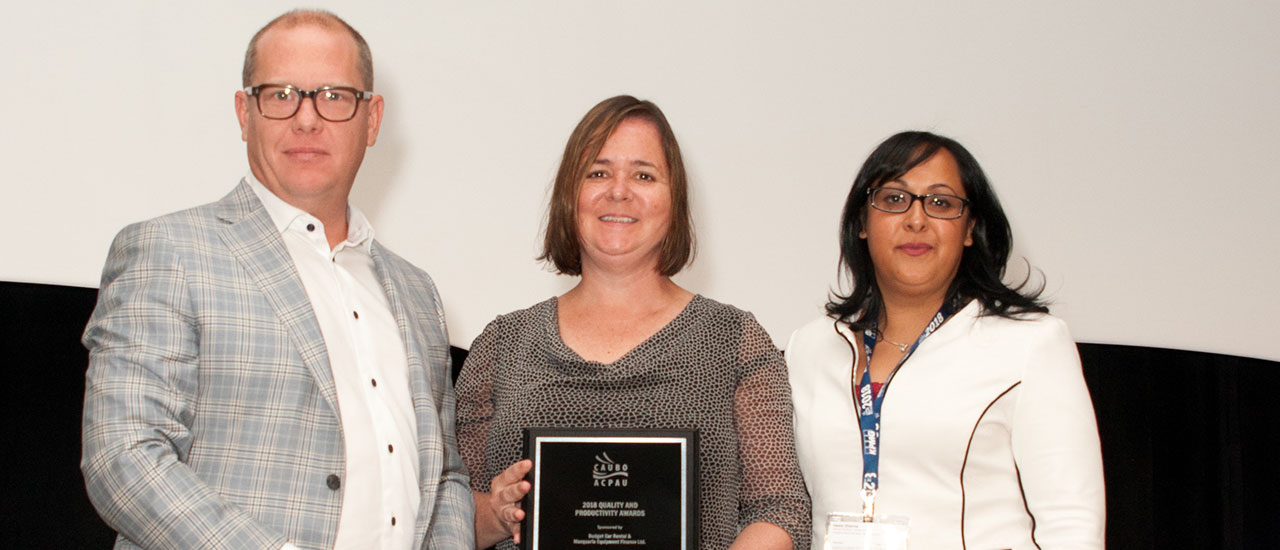 Deborah Brown and Geeta Sharma receiving the CAUBO Award for Office Ergonomics Program.