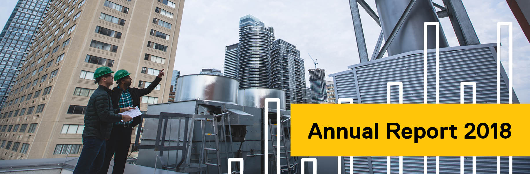 Annual Report 2018: Two members of the Environmental Health and Safety team inspecting a fume hood on the roof of a Ryerson building
