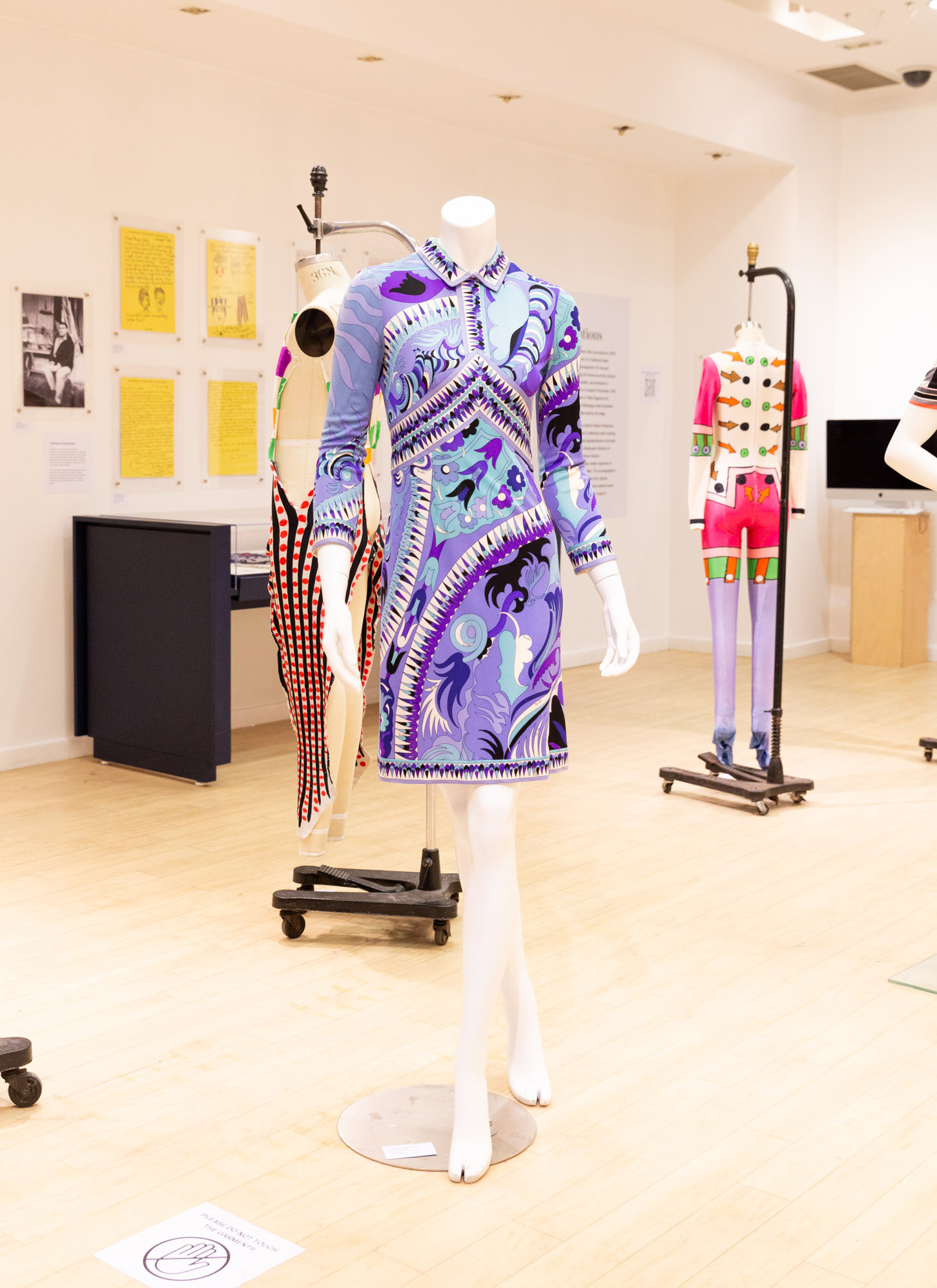 Close up of a multicoloured patterned Emilio Pucci dress in blues and purples. 