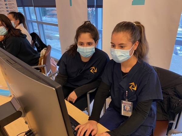 Nursing students working on computer