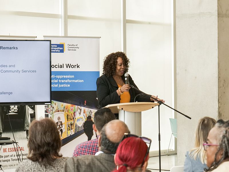 Valerie Borum addresses the audience from behind the podium