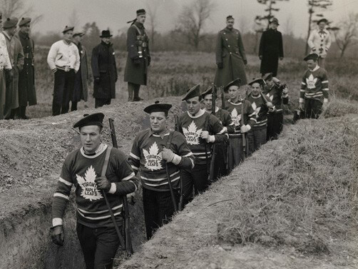 Members of the Toronto Maple Leaf hockey team in the trenches during a military training session, 1939, gelatin silver print. The Rudolph P. Bratty Family Collection, Ryerson Image Centre.