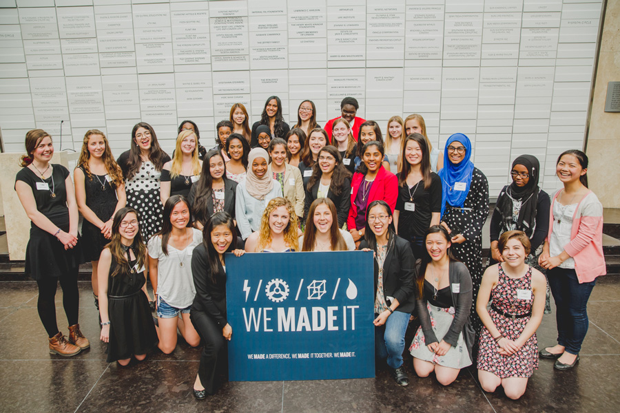 Students from Women in Engineering celebrate in the Sears Atrium on the third floor of the George Vari Engineering and Computing Centre at Ryerson University.