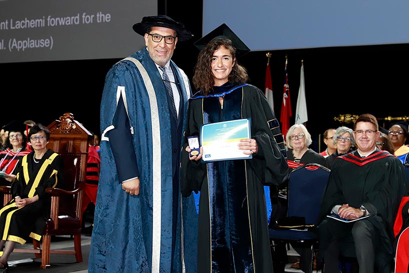 Dr. Sylvie Antoun accepts the Toronto Metropolitan University Gold Medal from President Mohamed Lachemi