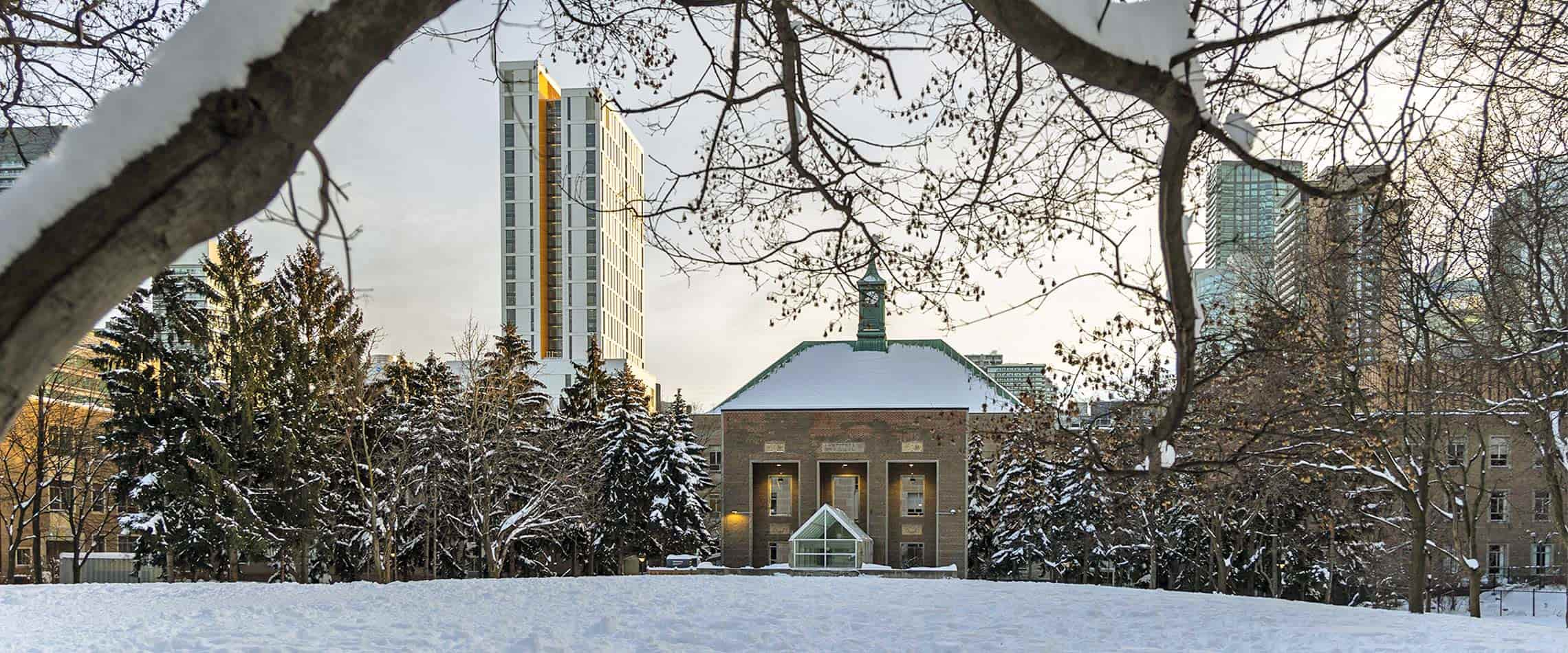 snowy view of the clock tower from the quad