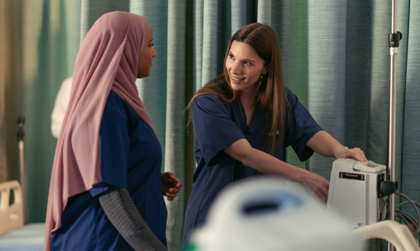 two medical students in a hospital setting