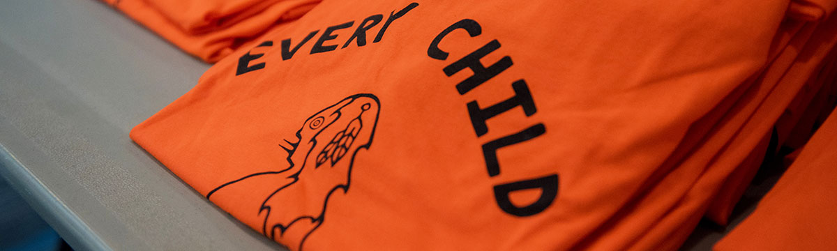 Orange shirt with the phrase "every child matters"