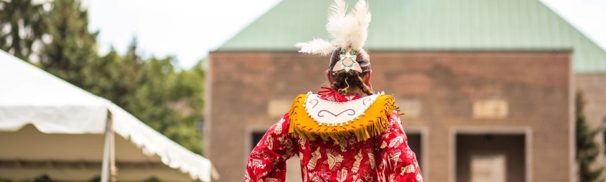 A Pow Wow dancer in traditional regalia