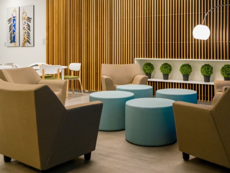  Staff and faculty wellbeing lounge with brown and blue modern furniture