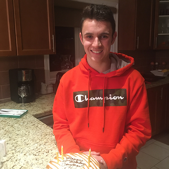 Jonathan Bradley with a birthday cake.