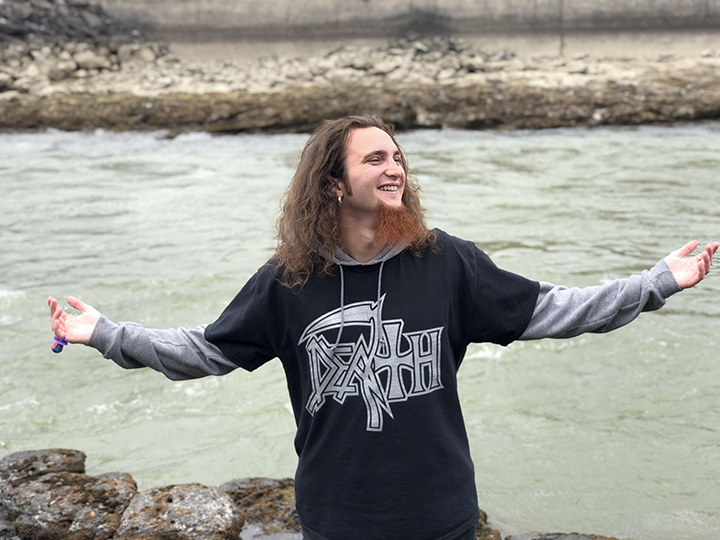 Manus Hopkins in front of a river.