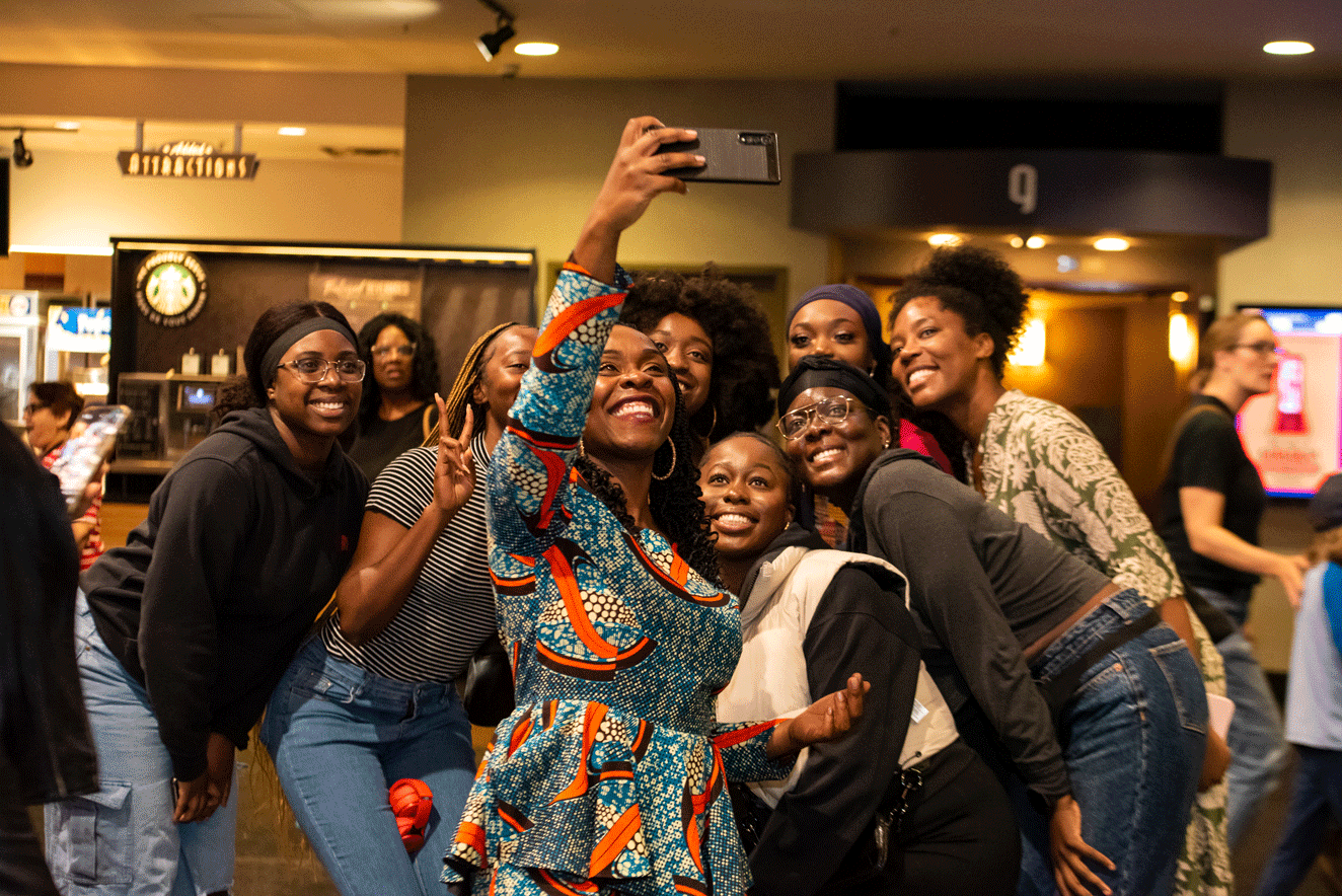 A group of women taking a selfie at Attendees at The Woman King screening