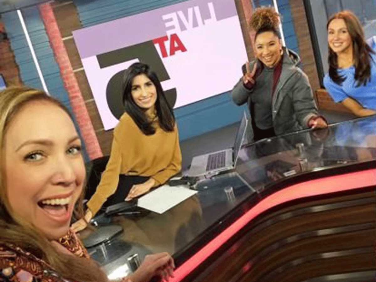 A self at the CP24 news desk showing Leena Latafat and three other female anchors