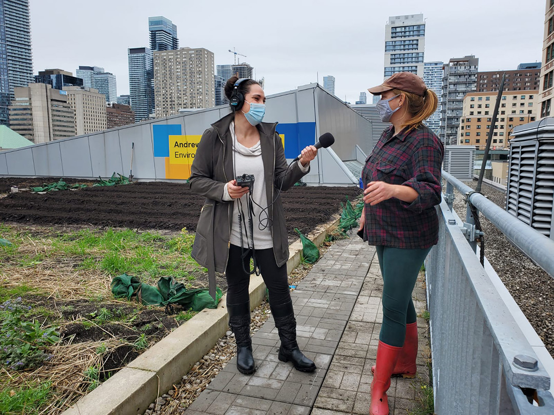 Amanda Cupido doing an interview on the roof of the Engineering building. 