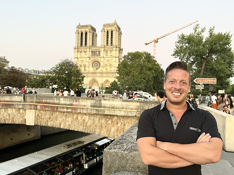 Alum Michael Pihach in front of Notre Dame Cathedral.