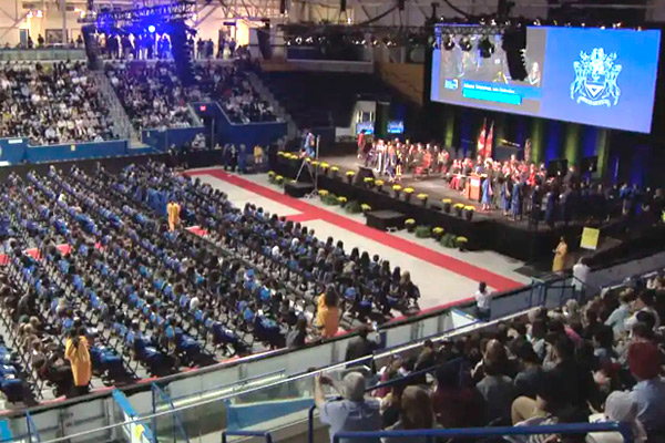 Panoramic view of a graduation ceremony at the Mattamy Athletic Centre