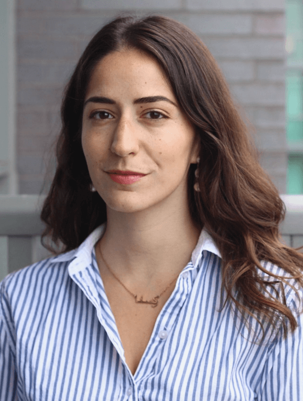 Roxana Parsa, staff lawyer, Legal Clinic programs, wearing a blue and white striped shirt