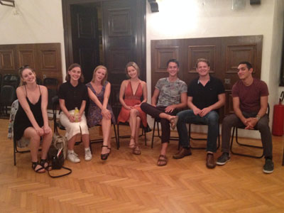 Students sitting in chairs in a half circle