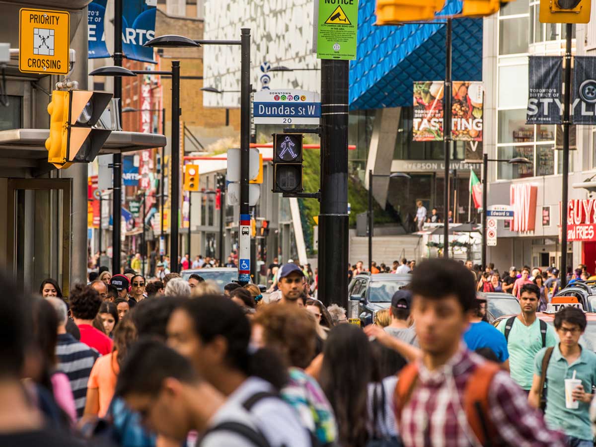 Crowd of people walking on street