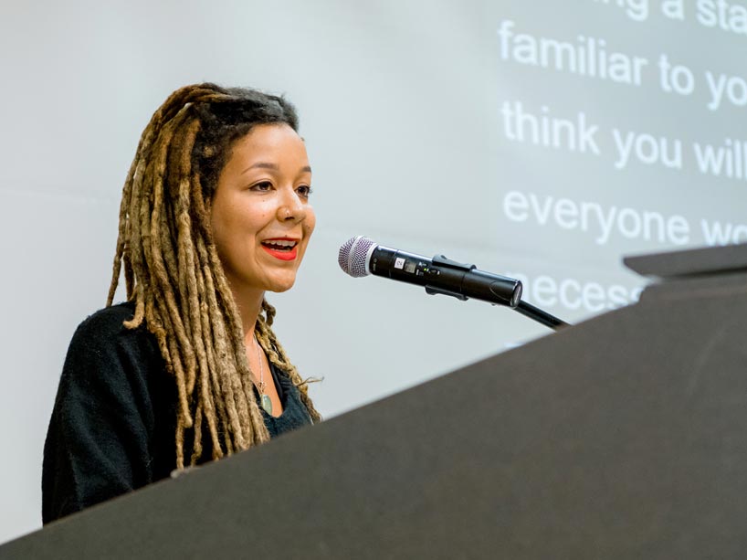 Writer and activist Robyn Maynard speaking at the podium