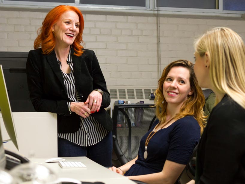 Candice Monson, far left, talking to two students