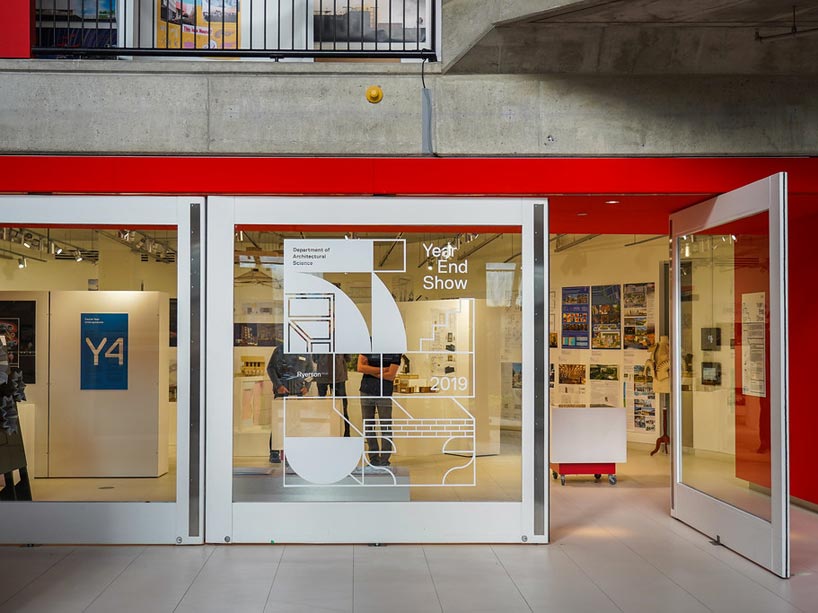 Glass door with writing on it leading to architectural science exhibition