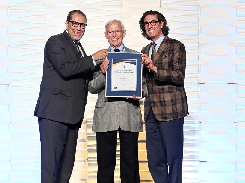 Volunteer with English language support, Jorgen Jensen (centre) with President Lachemi and Ian Mishkel.