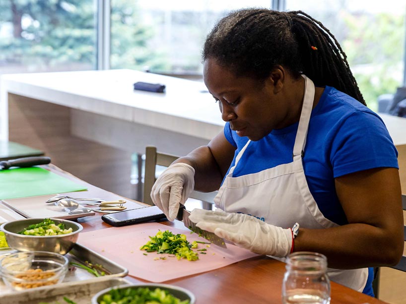 A woman chopping vegetables