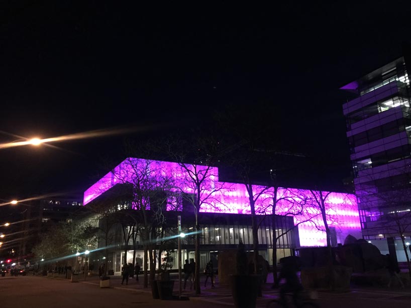 Ryerson Image Centre at night, lit up in purple lights.