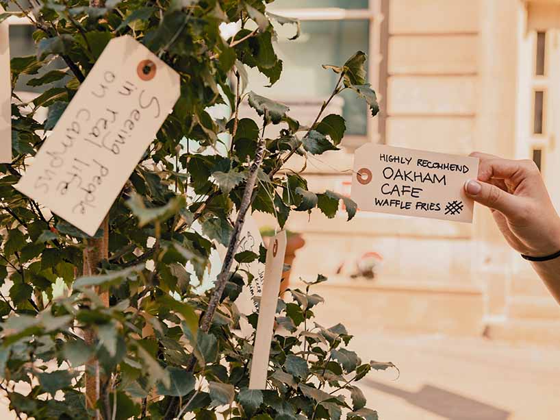 A handwritten note says, “highly recommend Oakham Cafe waffle fries”