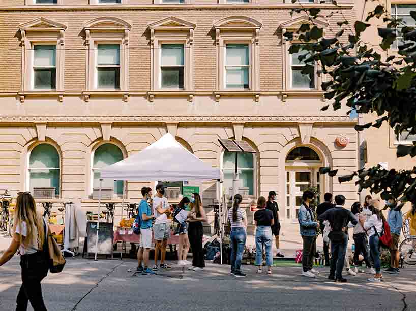 A crowd gathered in front of the School of Urban and Regional Planning building on Bond Street