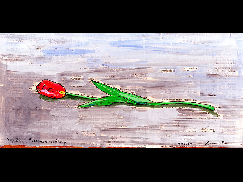 A painted rose laying on a surface.