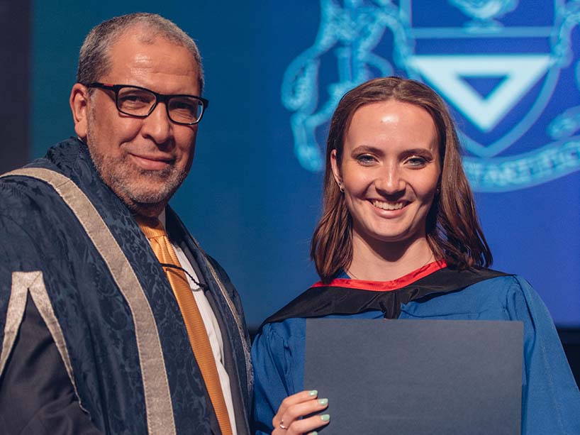 President Mohamed Lachemi and Gold Medal recipient Allison Mackenzie holding the Gold Medal award.