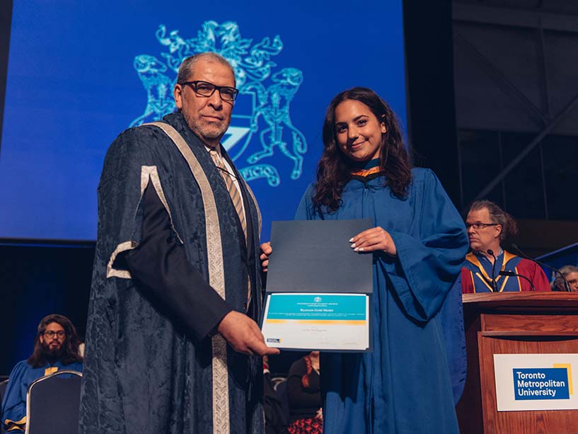 President Mohamed Lachemi and Gold Medal recipient Julia Pellegrino holding the Gold Medal award.